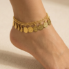 gold oriental anklet with coin charms and colorful beads worn on foot خلخال ذهبي شرقي مزين بعملات معدنية وخرز ملون على القدم Bracelet de cheville oriental dore avec pièces métalliques et perles colorées porté au pied
