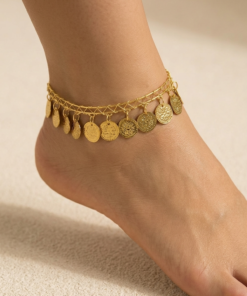 gold oriental anklet with coin charms and colorful beads worn on foot خلخال ذهبي شرقي مزين بعملات معدنية وخرز ملون على القدم Bracelet de cheville oriental dore avec pièces métalliques et perles colorées porté au pied