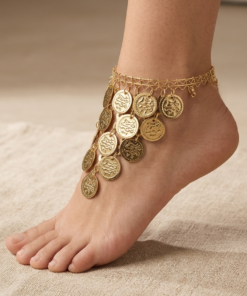 gold oriental anklet with coin charms and colorful beads worn on foot خلخال ذهبي شرقي مزين بعملات معدنية وخرز ملون على القدم Bracelet de cheville oriental dore avec pièces métalliques et perles colorées porté au pied