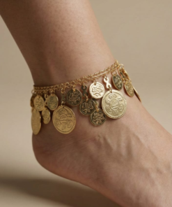 gold oriental anklet with coin charms and colorful beads worn on foot خلخال ذهبي شرقي مزين بعملات معدنية وخرز ملون على القدم Bracelet de cheville oriental dore avec pièces métalliques et perles colorées porté au pied